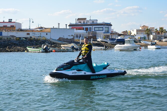 1 Hour Jet Ski Experience in Isla Canela - Guadiana River moment: Ayamonte fish market area and the border bridge underpass