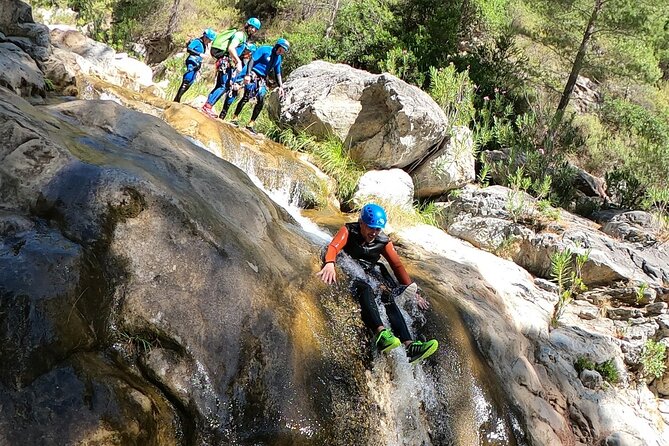 Canyoning Adventure Rio Verde in Granada - Down the canyon: slides, jumps into wells, and waterfall rappels