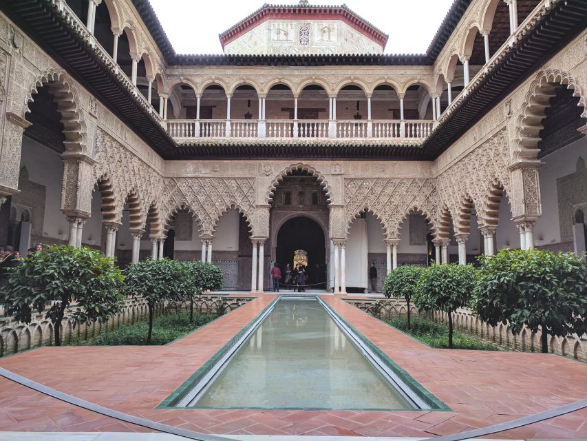From Costa del Sol: Sevilla Day Trip with Real Alcázar Tour - Entering the Alcázar: UNESCO palace in a real-world crowd