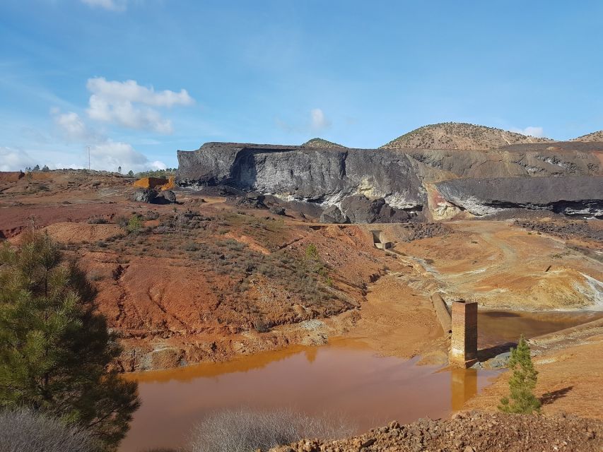From Seville: Full-Day Aracena & Rio Tinto Mines Tour - Gruta de las Maravillas: stalactites, deep blue water, and real wow factor