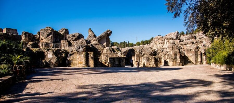 From Seville: Italica Roman City Tour - The Partially Reconstructed Roman Theater in Santiponce