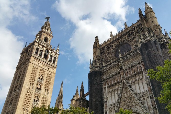 Guided Tour of Santa Cruz Jewish Quarter, Alcázar, and Cathedral - Giralda bell tower views: Moorish minaret, Christian bell tower