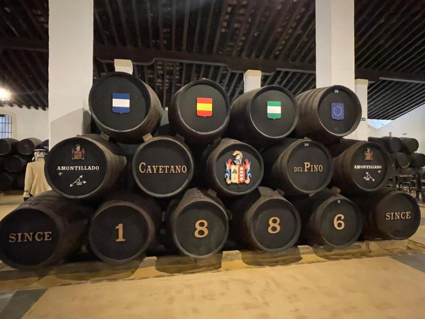 Jerez de la Frontera: Sherry Winery Tour with Tasting - Inside the 1886 Cayetano del Pino bodega: architecture, labels, and barrels