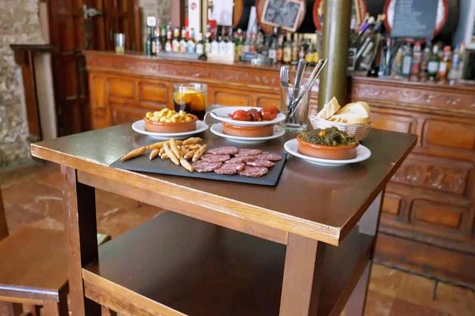Sevilla Food Tour: Tapas, Wine, History & Traditions - Santa Cruz: Albóndigas, pestiños, and a patio moment in a family home