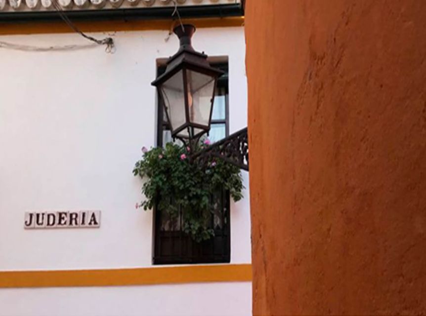Seville: 1-Hour Walking Tour Barrio de Santa Cruz - Getting oriented: Calle Miguel de Mañara and the orange umbrella