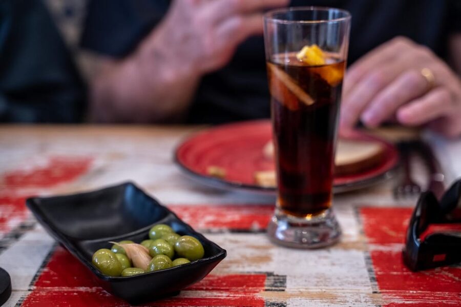 Seville Adventure: Historic Walking Tour & Traditional Tapas - Puerta del Perdón and Alcaicería de la Seda: The Muslim Market Story