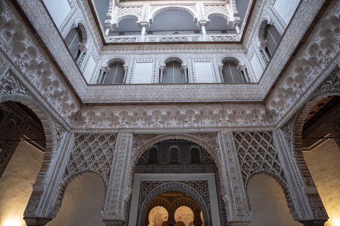 Seville Alcázar: Guided Premium Tour with Priority Entrance - Inside highlights: Lion Gate, Justice Hall, Patio de la Morería, Pond of Mercury