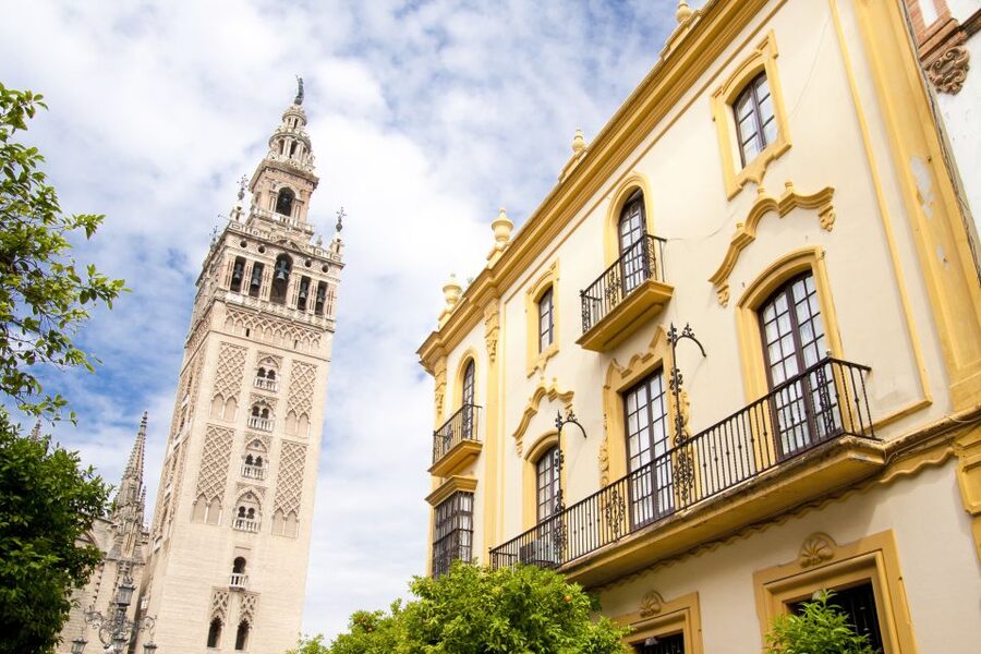 Seville: Cathedral and Alcázar Guided Tour - La Giralda from the Cathedral entrance: Moorish minaret into city icon