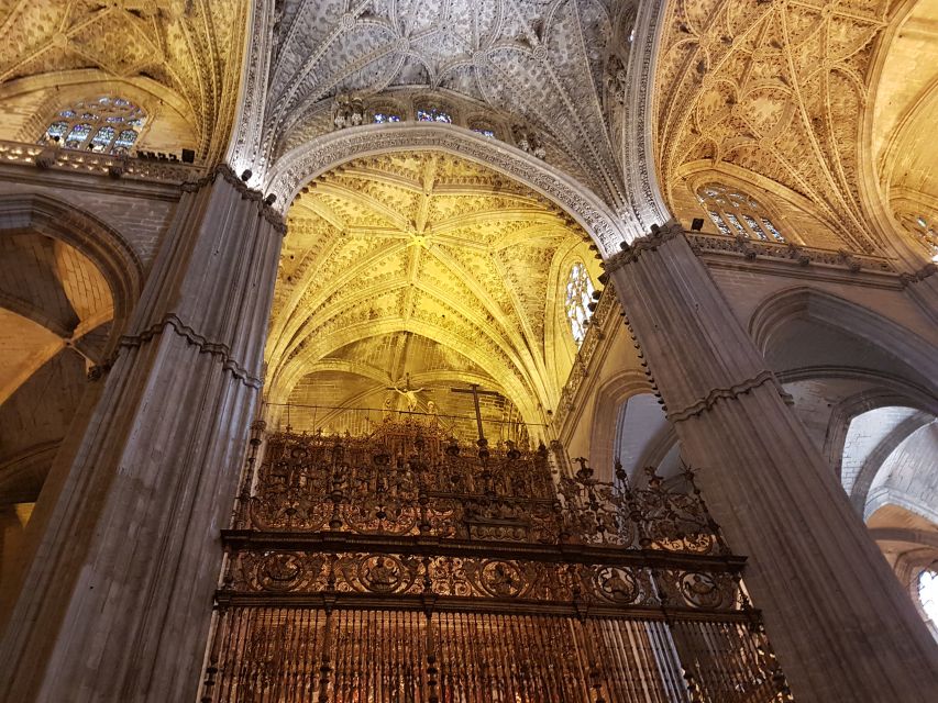 Seville Cathedral & Giralda Private Tour including tickets - Inside Seville Cathedral: Gothic Scale, Mosque Origins, and Columbus