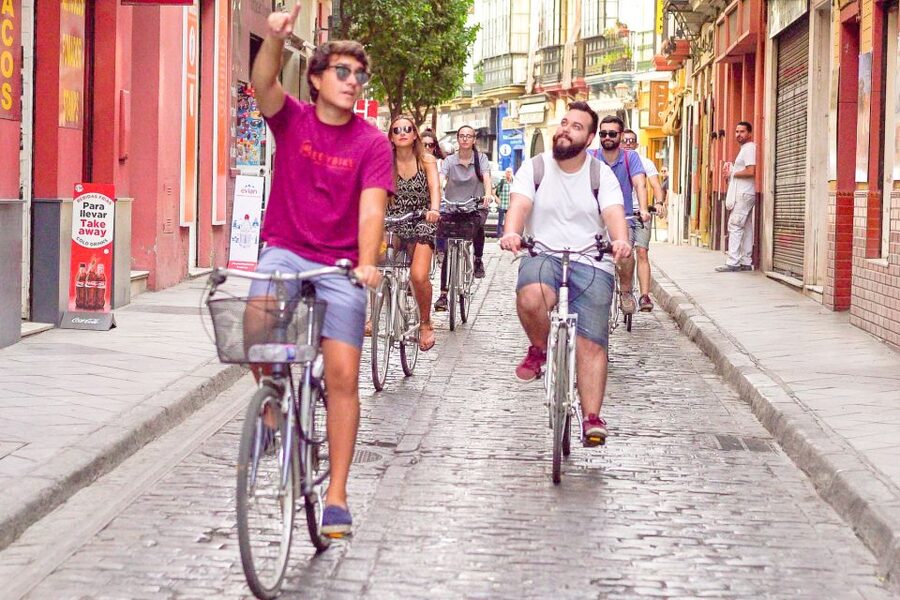 Seville: City Sightseeing and Local Culture Bike Tour - Triana and the river mood on the ride out