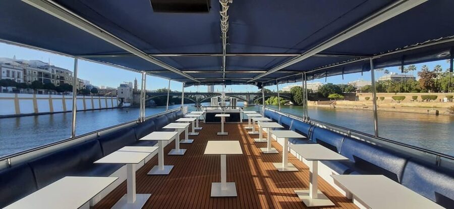 Seville: Guadalquivir Boat Tour with Optional Lunch/Dinner - Comfort on the Water: Sun Terrace, AC, Heating, and Music