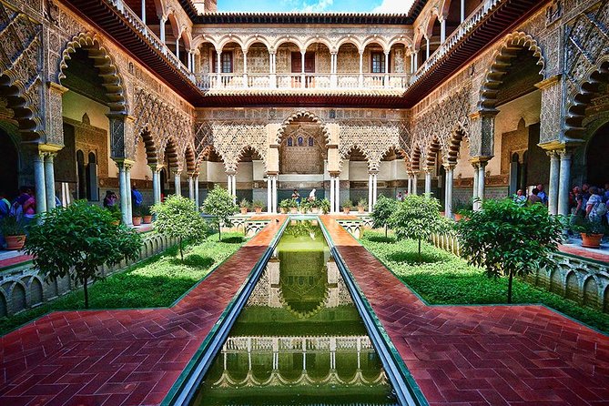 Seville Guided Tour into Alcazar and Cathedral Skip the Line - Real Alcázar of Seville: Courtyards, Gardens, and Royal Power