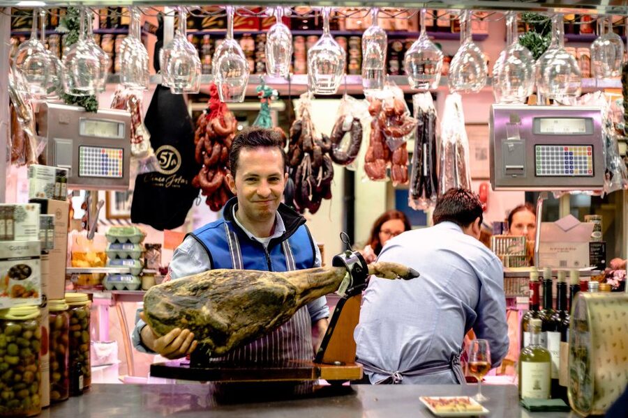 Seville: Morning Market & Tapas Tour - A 3-hour Seville food walk that actually helps you travel