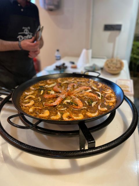 Seville: Paella and Sangria Experience - Where the experience begins: snacks and local tastings at Terraza del Cristina