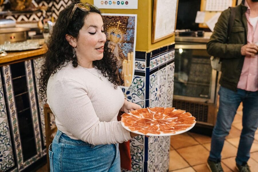 Seville: Private Tapas & History Tour in Triana Neighborhood - Starting at Los Especiales area: getting your bearings fast