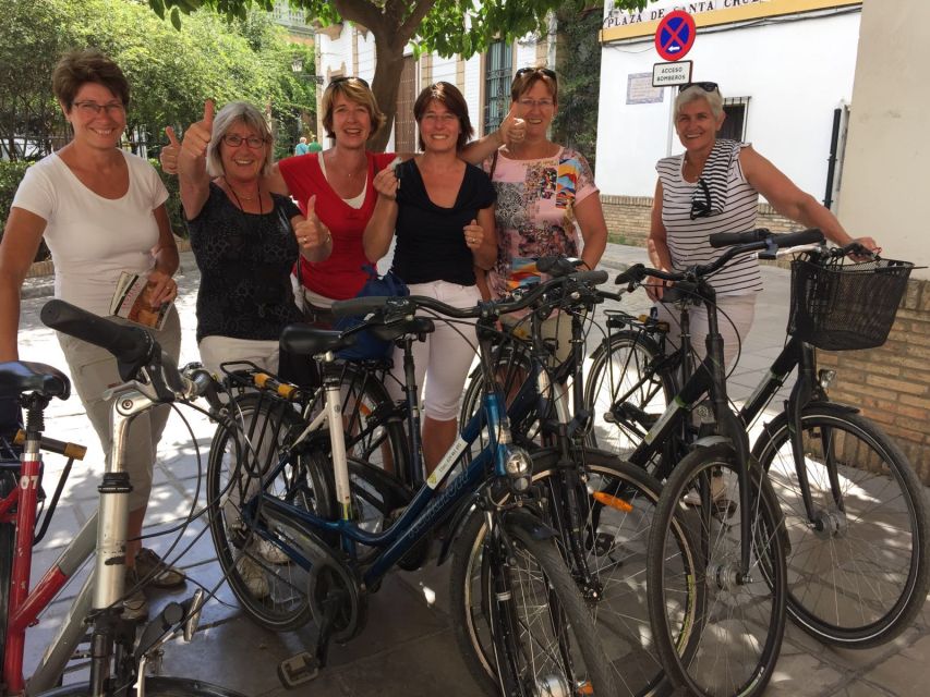 Seville: Relaxing Electric Bike tour with Tour Guide - Barrio Santa Cruz lanes on electric assist