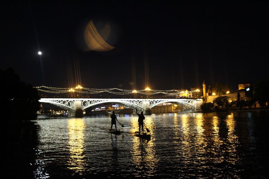 Seville: Sunset and Evening Paddle Boarding Tour - Guides, Stories, and the Human Side of the Night