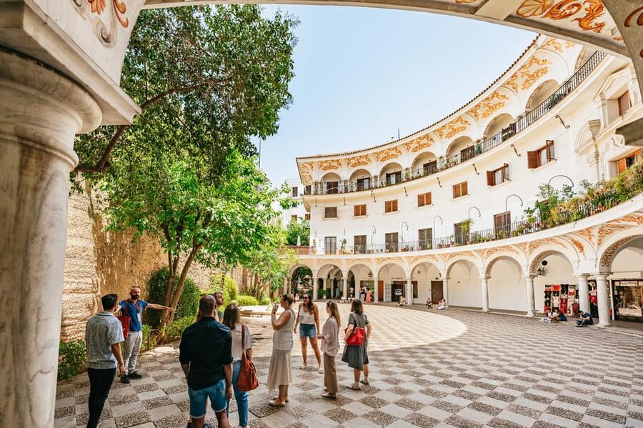 Seville: Tapas, Taverns and History Guided Walking Tour - Stop 1 at Las Teresas: potato salad, Iberian ham, and sweet red vermouth