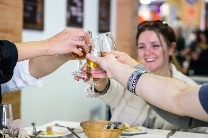 Seville: Triana Market Tapas Tour - Guides who connect the food to the place